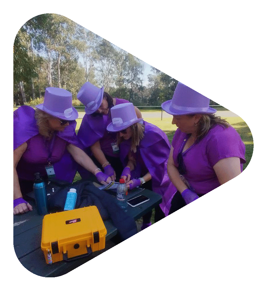 Participants solving a clue during hands-on corporate team building activity in Melbourne