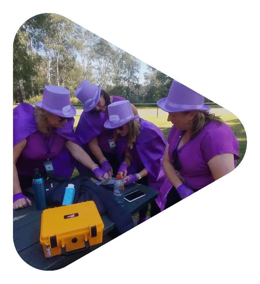 Participants solving a clue during hands-on corporate team building activity in Melbourne