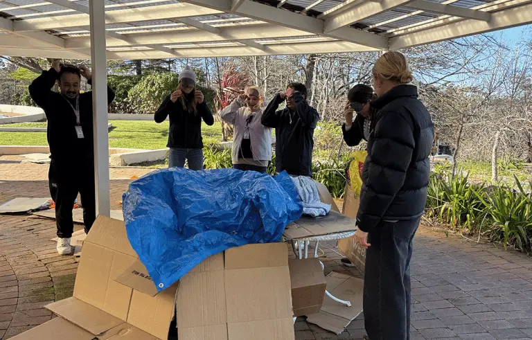 Corporate team building challenge with shelter building at Fairmont Resort, Blue Mountains