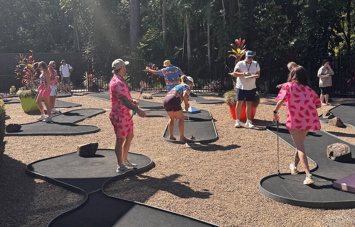 Teams playing mini golf at AMAZEworld during a Sunshine Coast Amazing Race