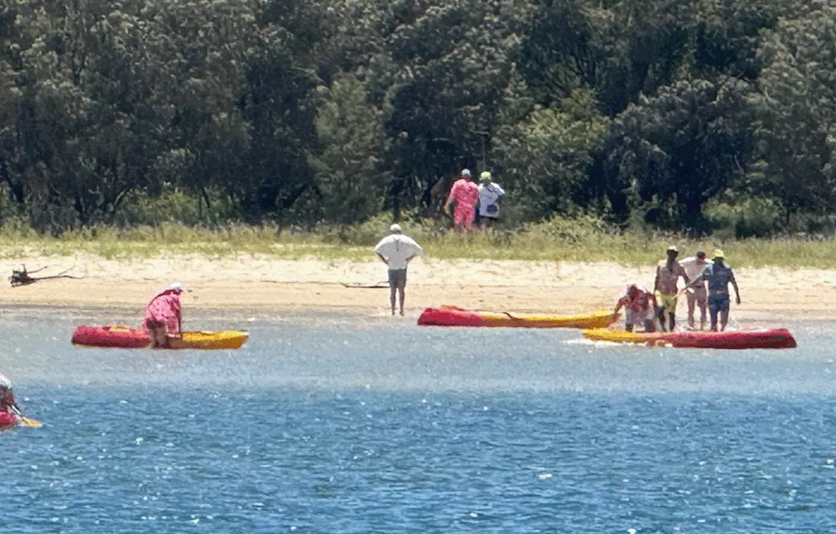 Costumed teams kayaking to Bribie Island during an Amazing Race for private parties