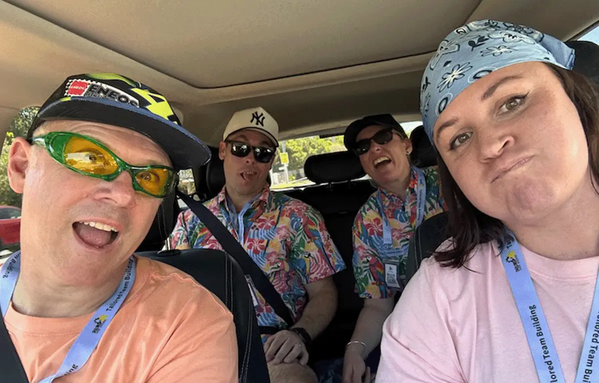 Team solving a cipher challenge to unlock clues in a Sunshine Coast Amazing Race