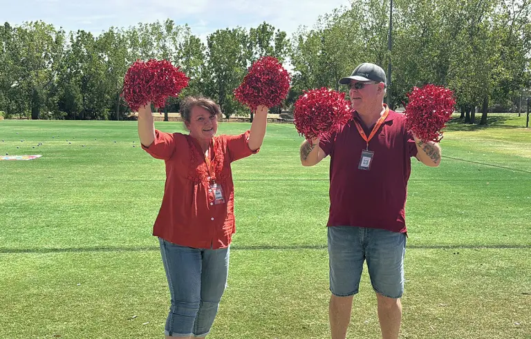 Teams performing cheer routines in a Driving Amazing Race hens and bucks party