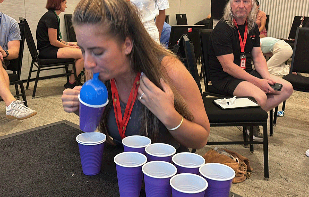 Fun corporate team building game show with teams competing in Minute to Win It challenges