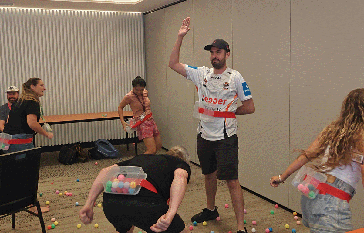 Indoor team building activity used as a wet weather backup plan during corporate event