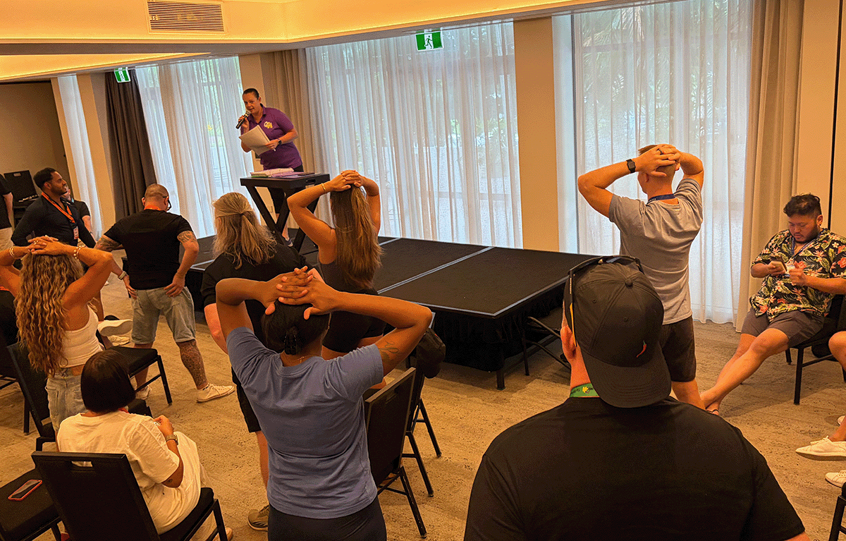 Fun corporate team building game show with teams competing in Minute to Win It challenges