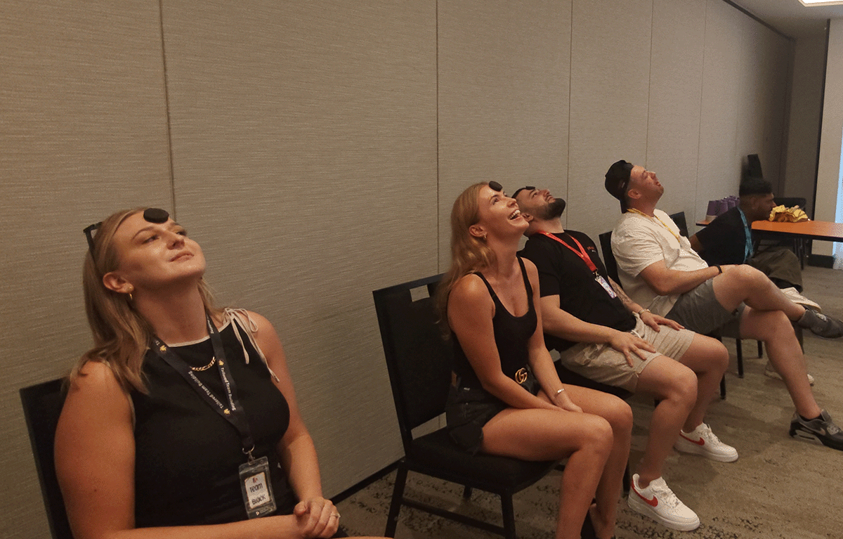 Fun corporate team building game show with teams competing in Minute to Win It challenges