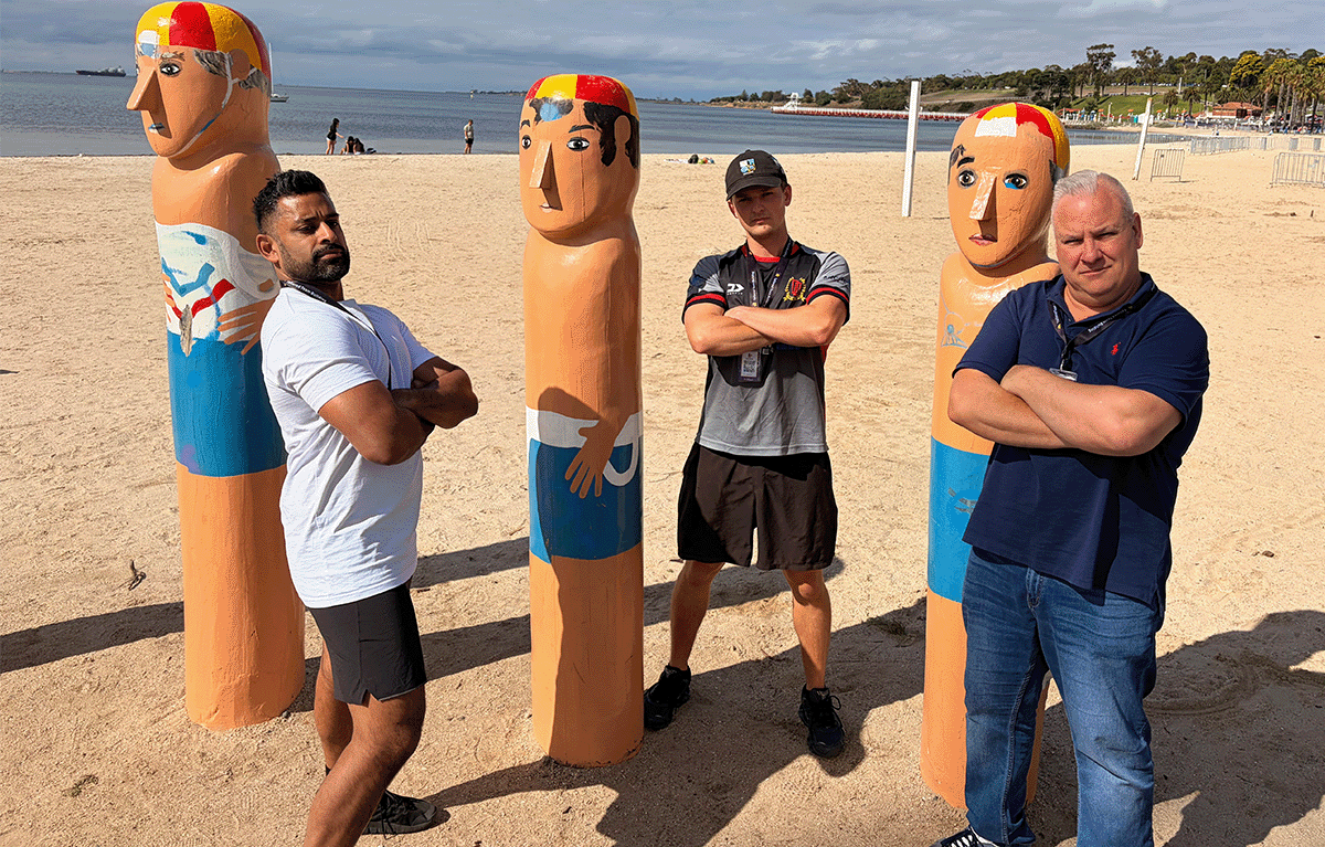 Teams taking creative photos with Geelong waterfront statues team building