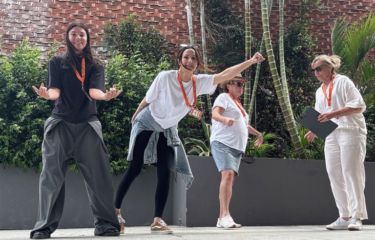 Corporate team building participants competing in a multi-city Amazing Race event across Australia