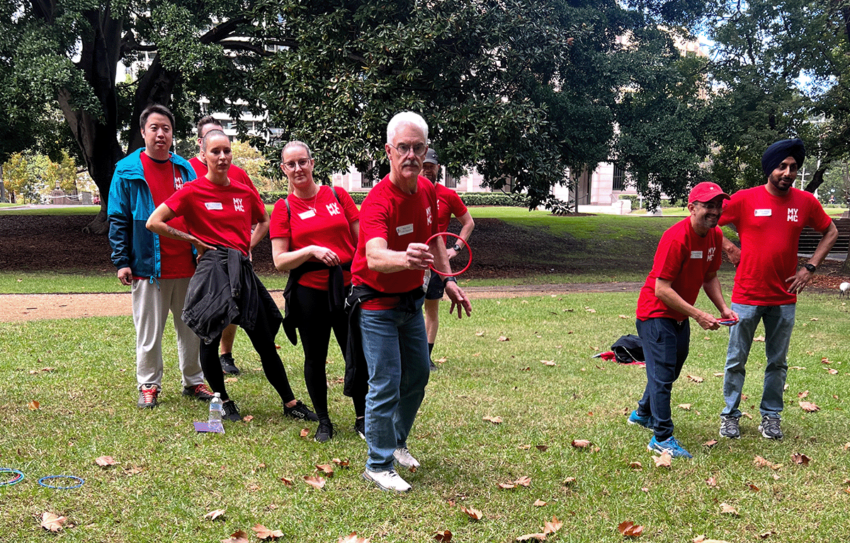 Teams completing fun team building challenges during a Sydney Corporate Amazing Race