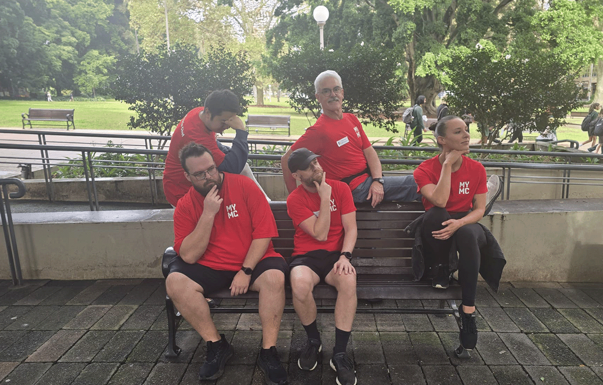 Corporate team laughing during outdoor team building activity in Sydney city