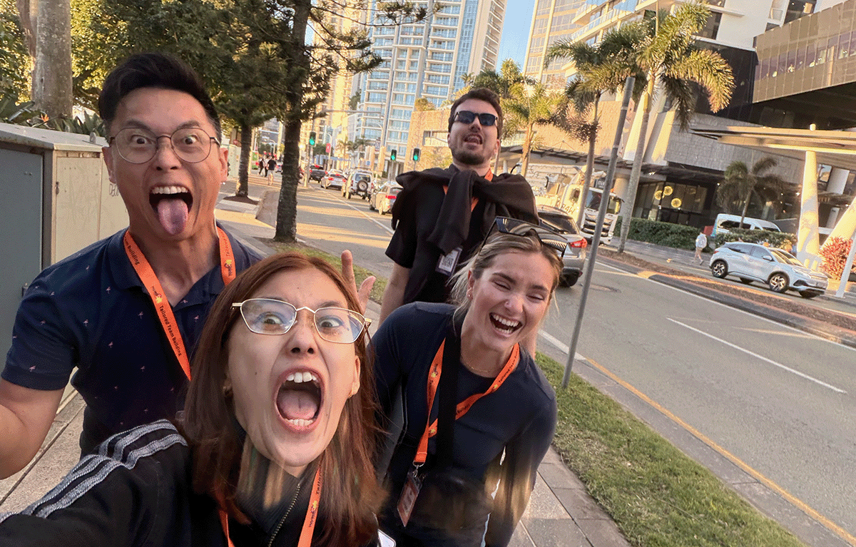 Corporate Amazing Race teams exploring the Gold Coast foreshore during a conference team building event.