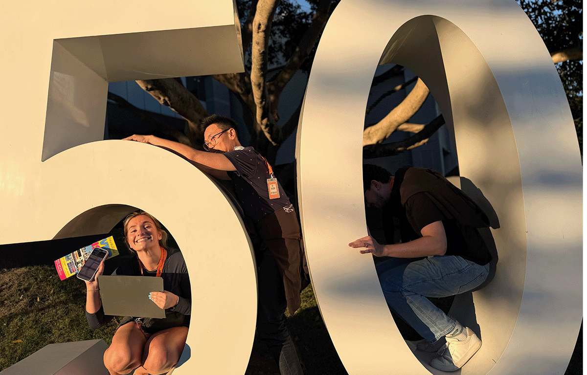 Corporate Amazing Race teams exploring the Gold Coast foreshore during a conference team building event.