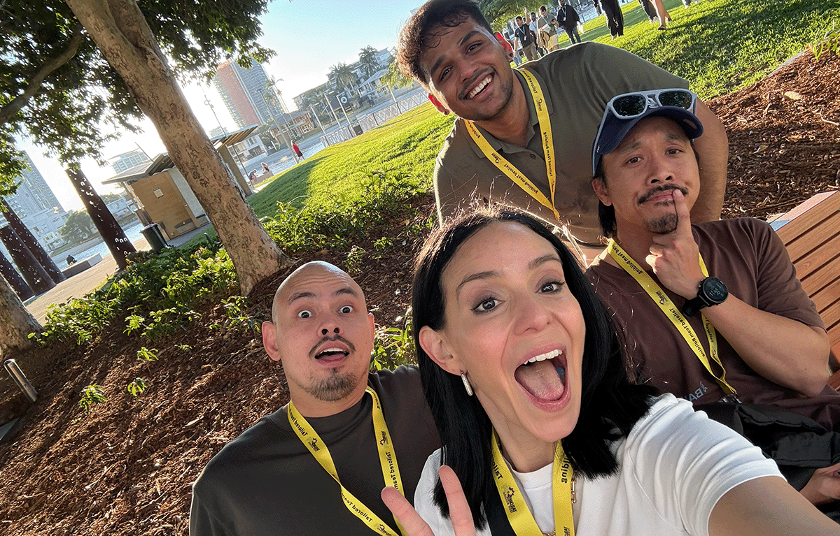 Corporate Amazing Race teams exploring the Gold Coast foreshore during a conference team building event.
