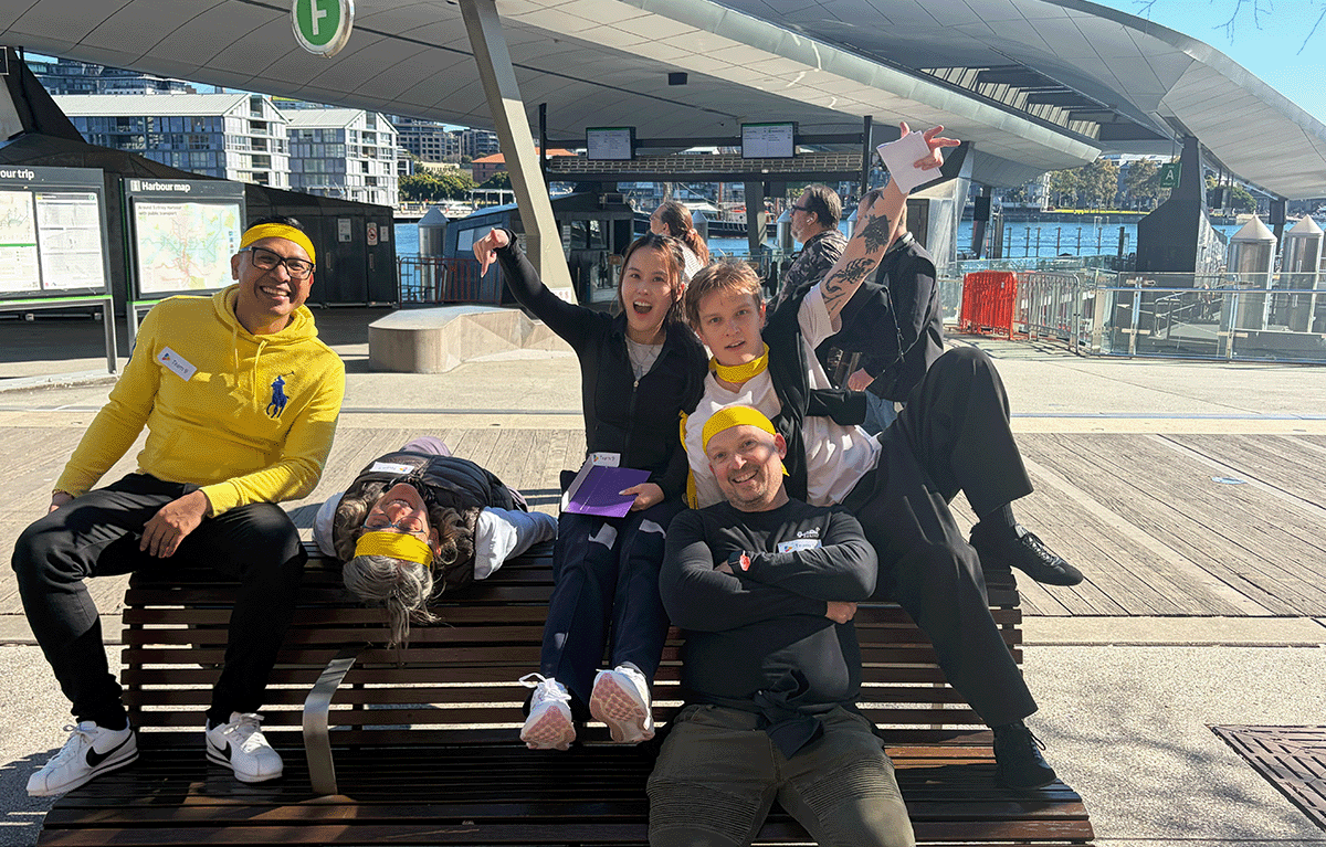 Corporate Amazing Race Sydney participants completing fun team building challenges around Sydney.