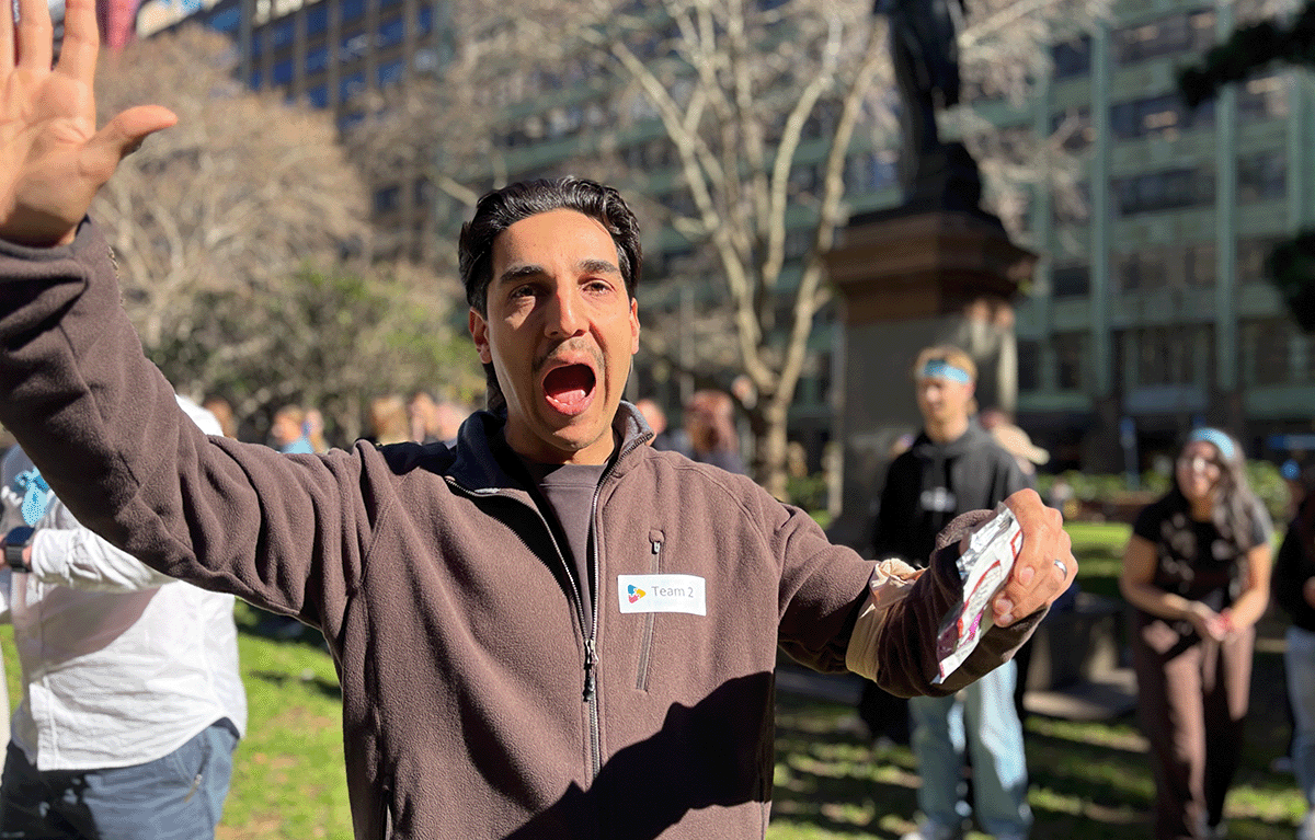 Corporate Amazing Race Sydney participants completing fun team building challenges around Sydney.
