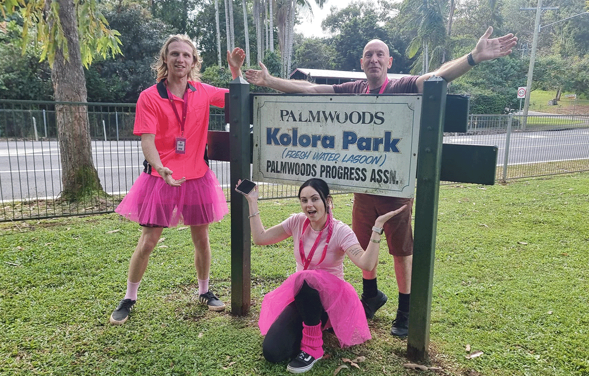 Corporate team celebrating after completing a checkpoint in a Driving Amazing Race on the Sunshine Coast.