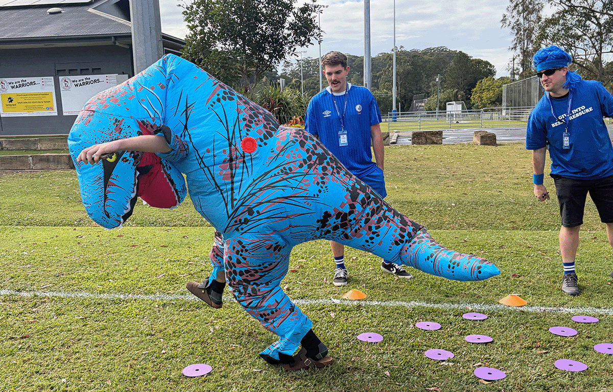 Corporate team celebrating after completing a checkpoint in a Driving Amazing Race on the Sunshine Coast.
