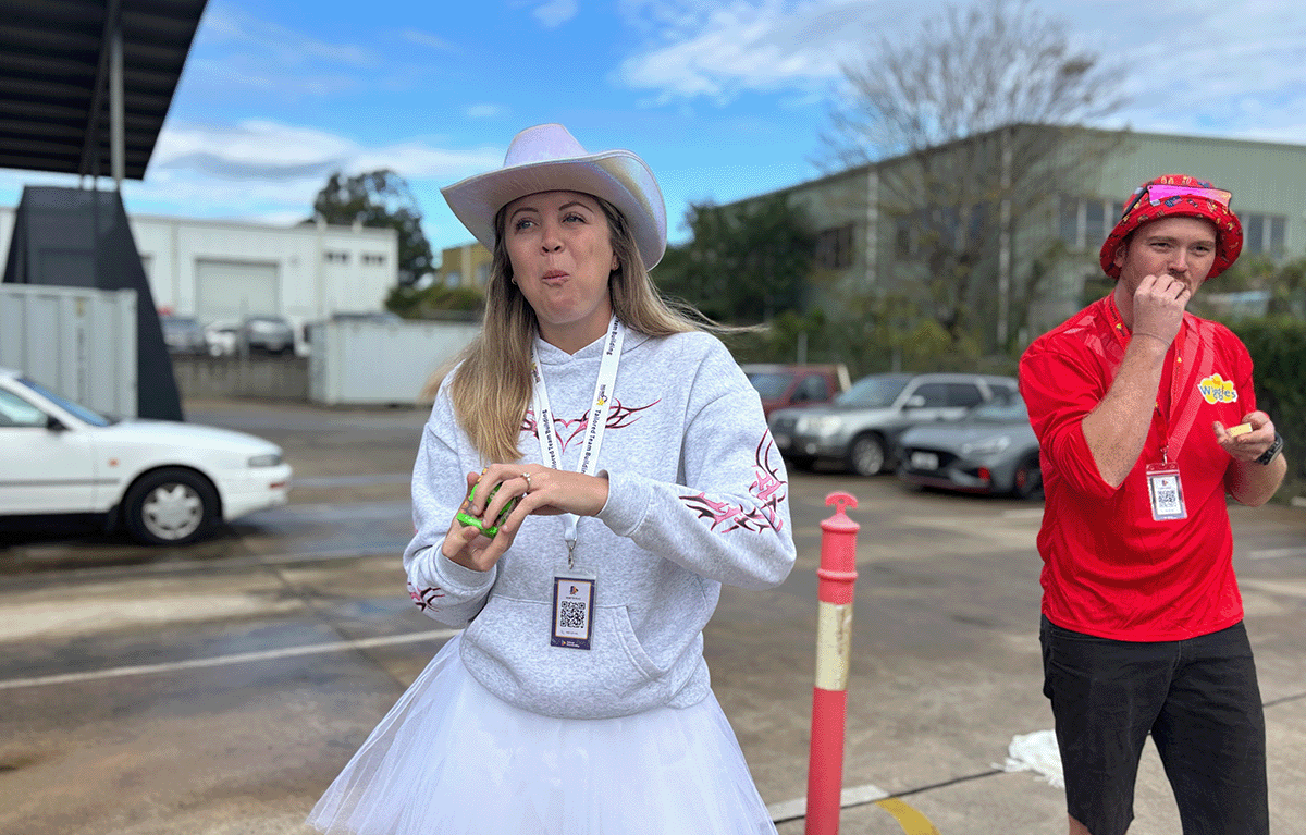 Teams in costume preparing for a Driving Amazing Race team building event on the Sunshine Coast.