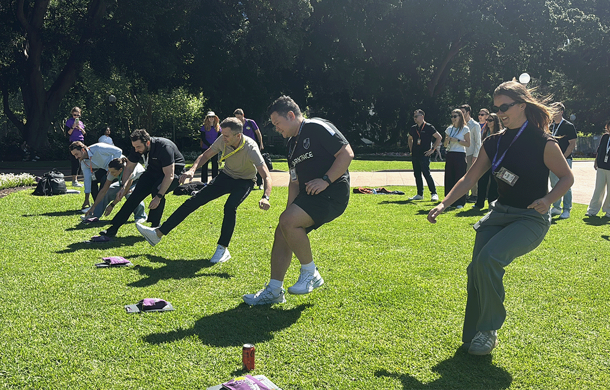 Teams completing interactive challenges during a Multi-City Corporate Amazing Race