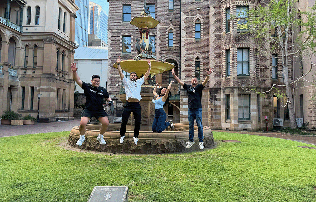 Teams completing interactive challenges during a Multi-City Corporate Amazing Race