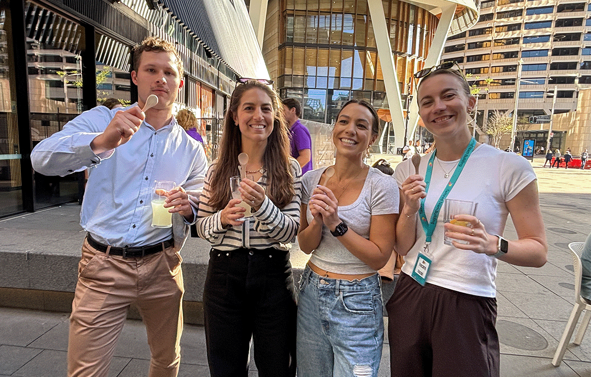 Teams completing interactive challenges during a Multi-City Corporate Amazing Race
