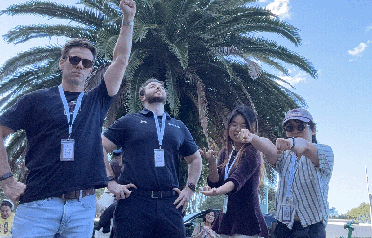 Teams completing interactive challenges during a Multi-City Corporate Amazing Race