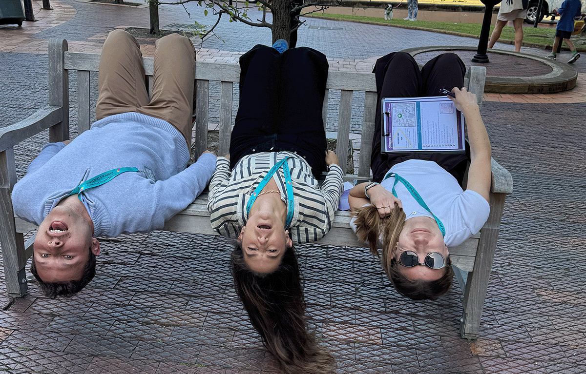 Teams completing interactive challenges during a Multi-City Corporate Amazing Race