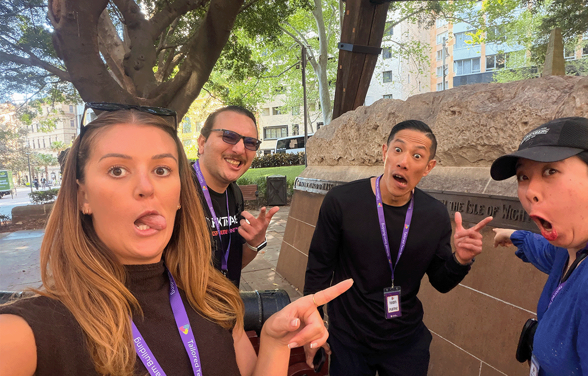Teams completing interactive challenges during a Multi-City Corporate Amazing Race
