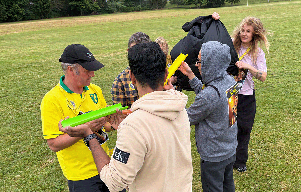 Teams having fun during a rainy outdoor amazing race
