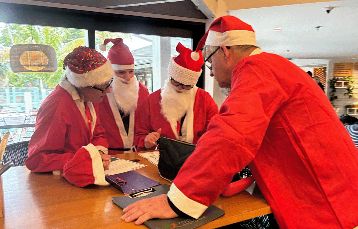 Teams having fun during a rainy outdoor amazing race