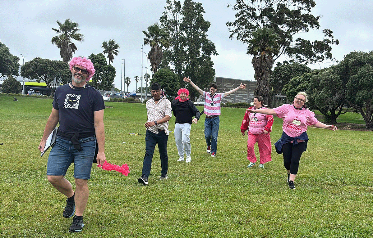 Teams having fun during a rainy outdoor amazing race