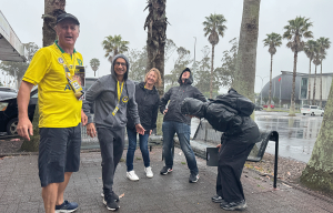 Teams having fun during a rainy outdoor amazing race