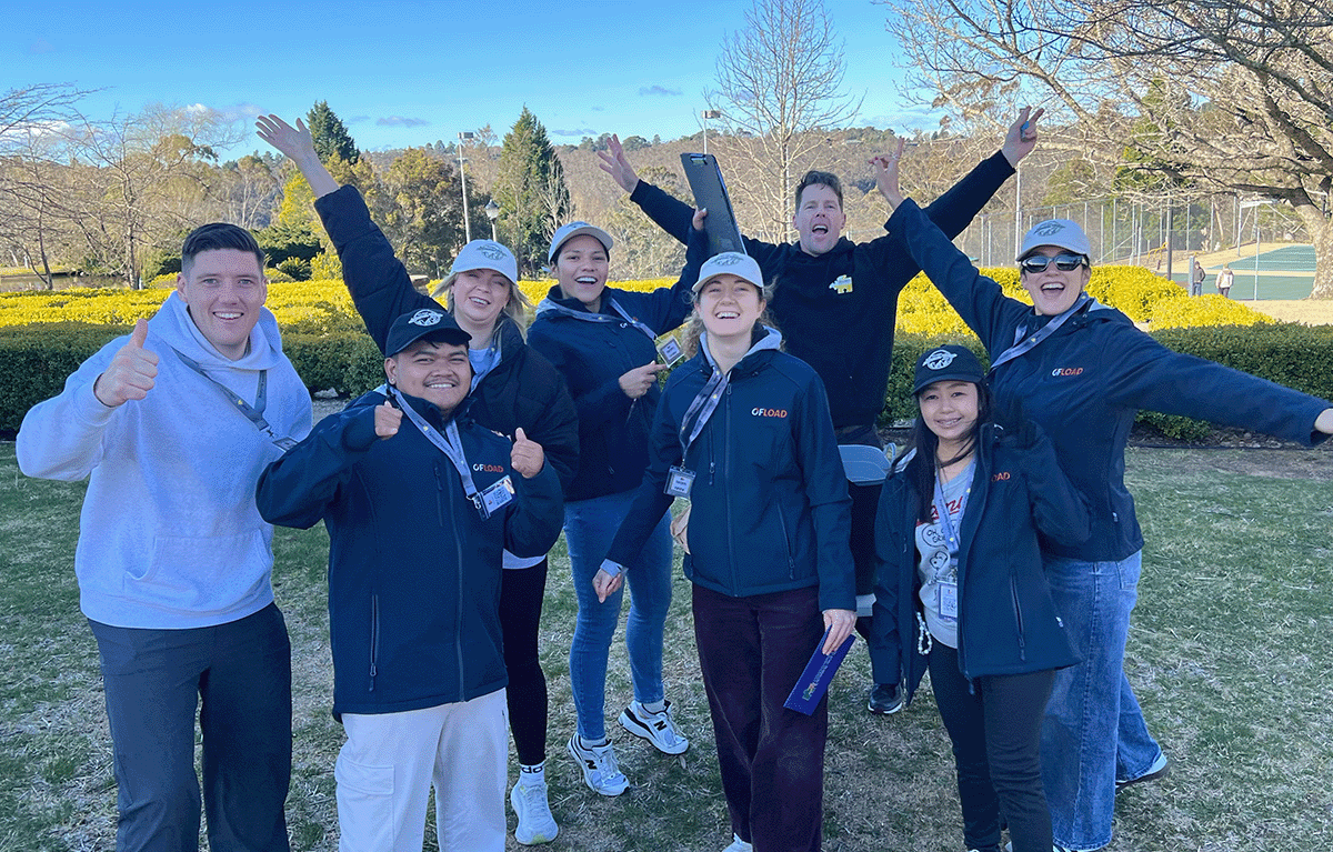 Corporate amazing race Dunedin teams solving clues in the city centre