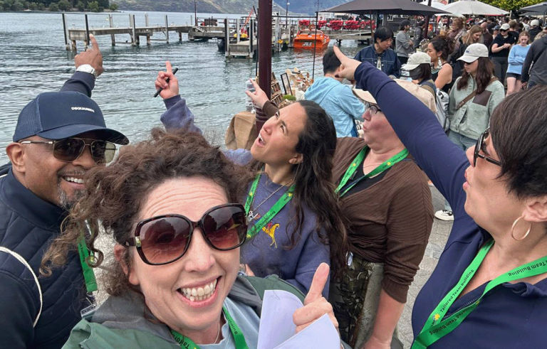 Adventure race teams exploring Queenstown streets during a corporate team building event