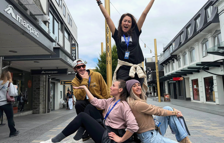 Adventure race teams exploring Queenstown streets during a corporate team building event