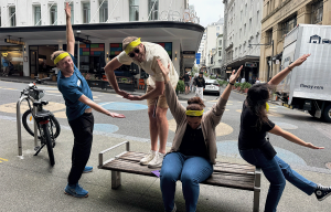 Corporate Amazing Race teams racing through Auckland CBD during team building event