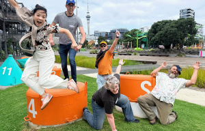Corporate Amazing Race teams racing through Auckland CBD during team building event