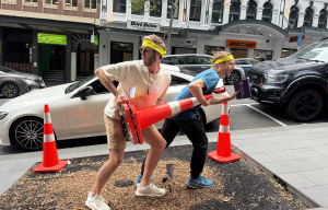 Corporate Amazing Race teams racing through Auckland CBD during team building event