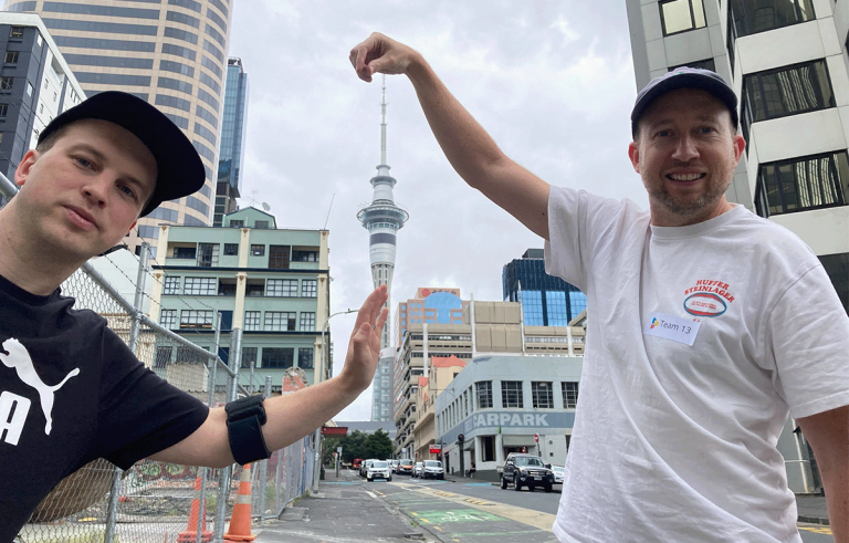 Teams running between checkpoints in Auckland Amazing Race team building event