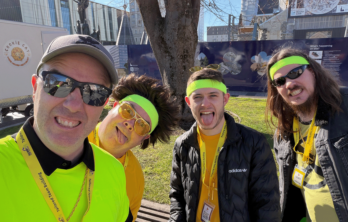 Rave Build teams in colourful outfits during a Christchurch Amazing Race team building event.