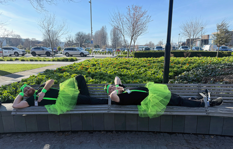 Rave Build teams in colourful outfits during a Christchurch Amazing Race team building event.